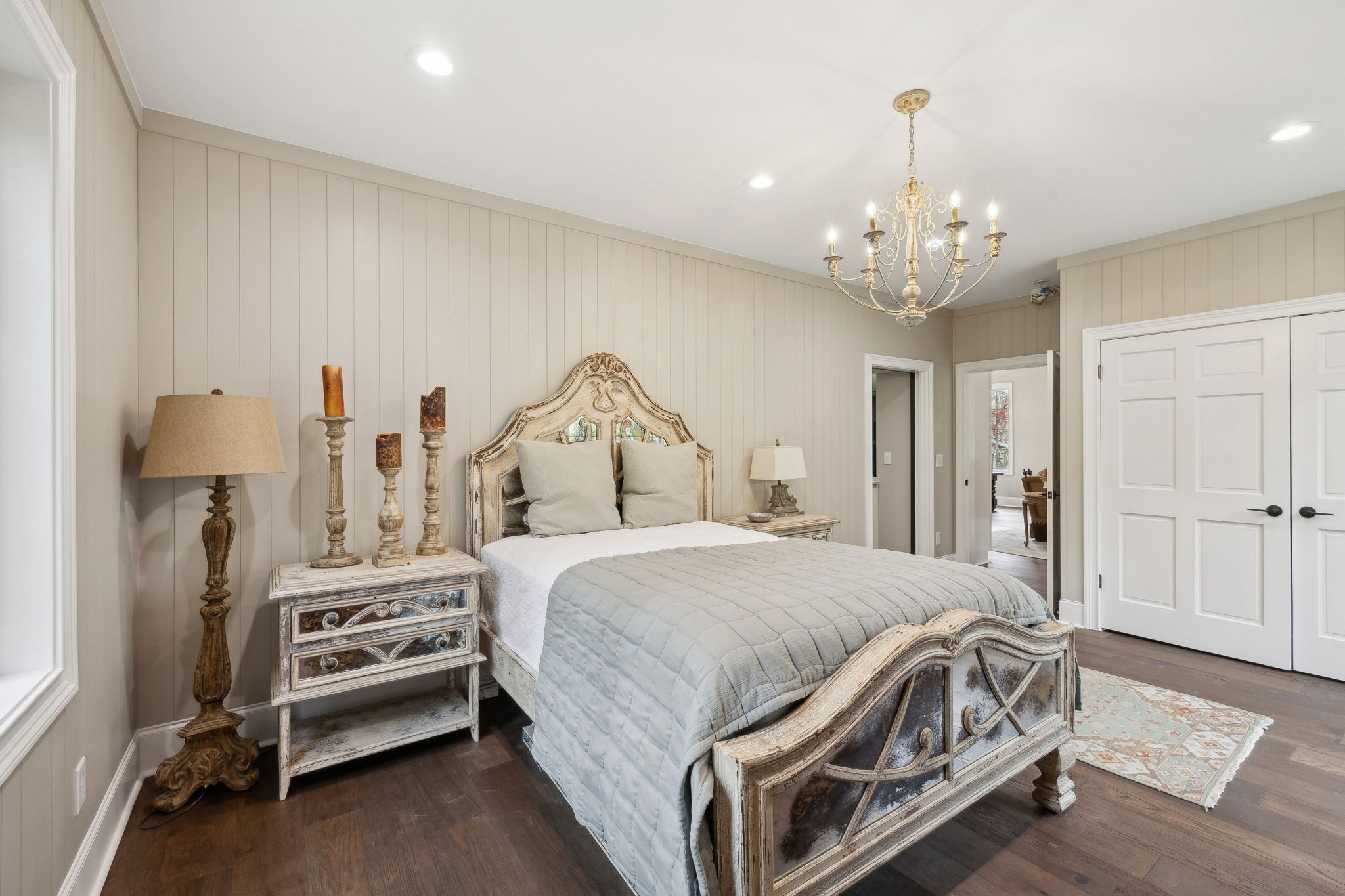 3110 McMillan Road Franklin, TN 37064 - Photo 26 of 96 a bedroom with a bed and a chandelier