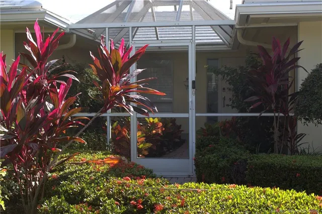 a view of a flower in front of a house