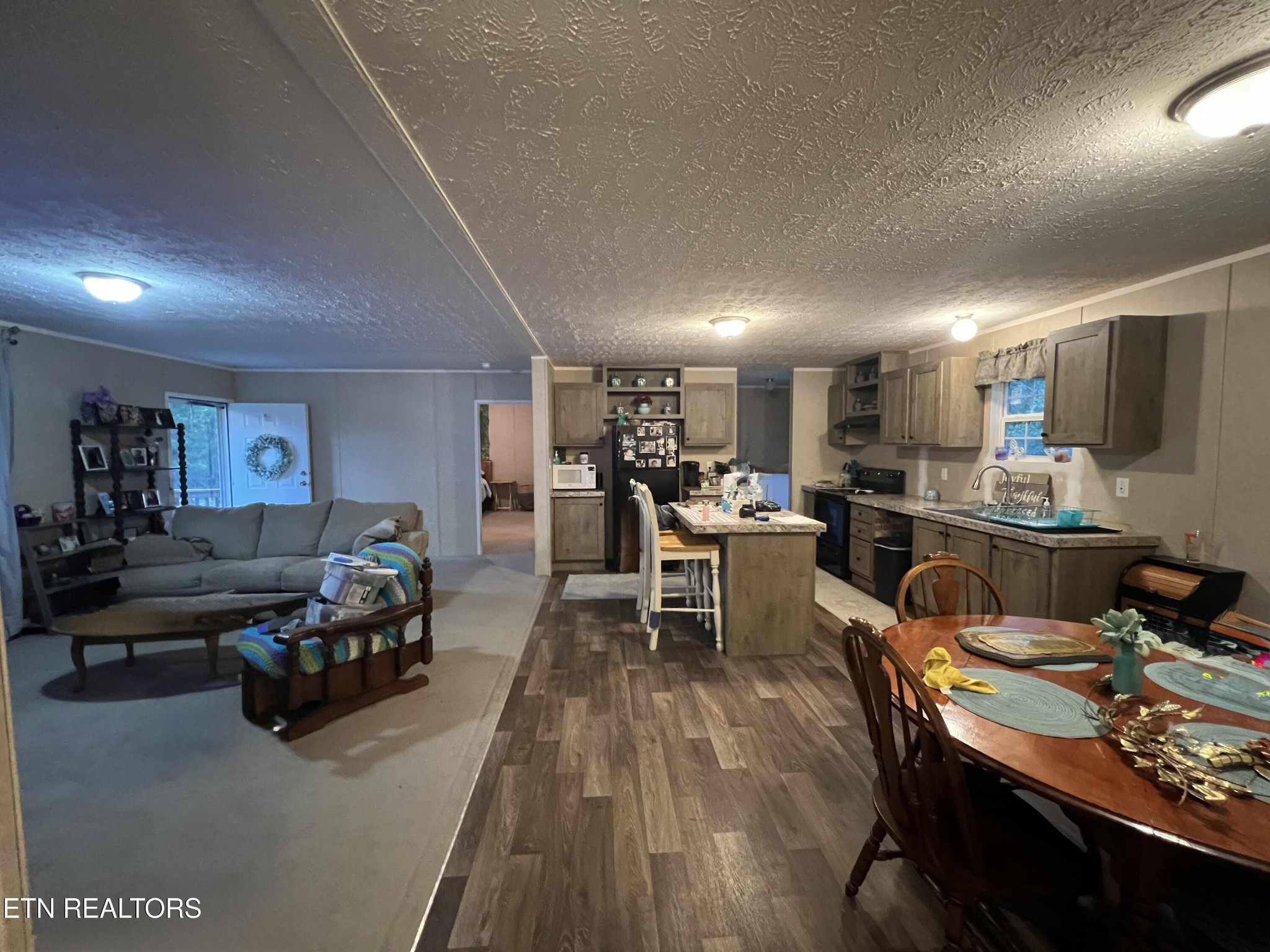 10207 Alex Bales Road Kodak, TN 37764 - Photo 6 of 18 a living room with furniture and kitchen view