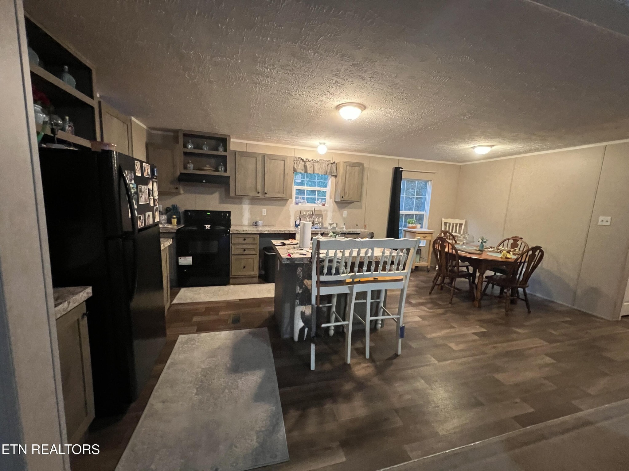 10207 Alex Bales Road Kodak, TN 37764 - Photo 7 of 18 a dining room with furniture and a kitchen view