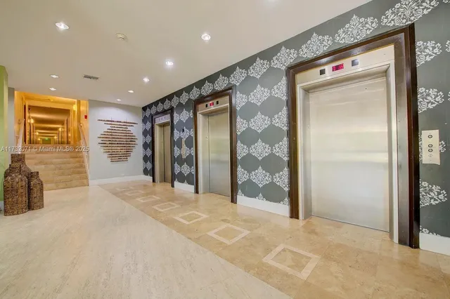 a view of a hallway with wooden shelves