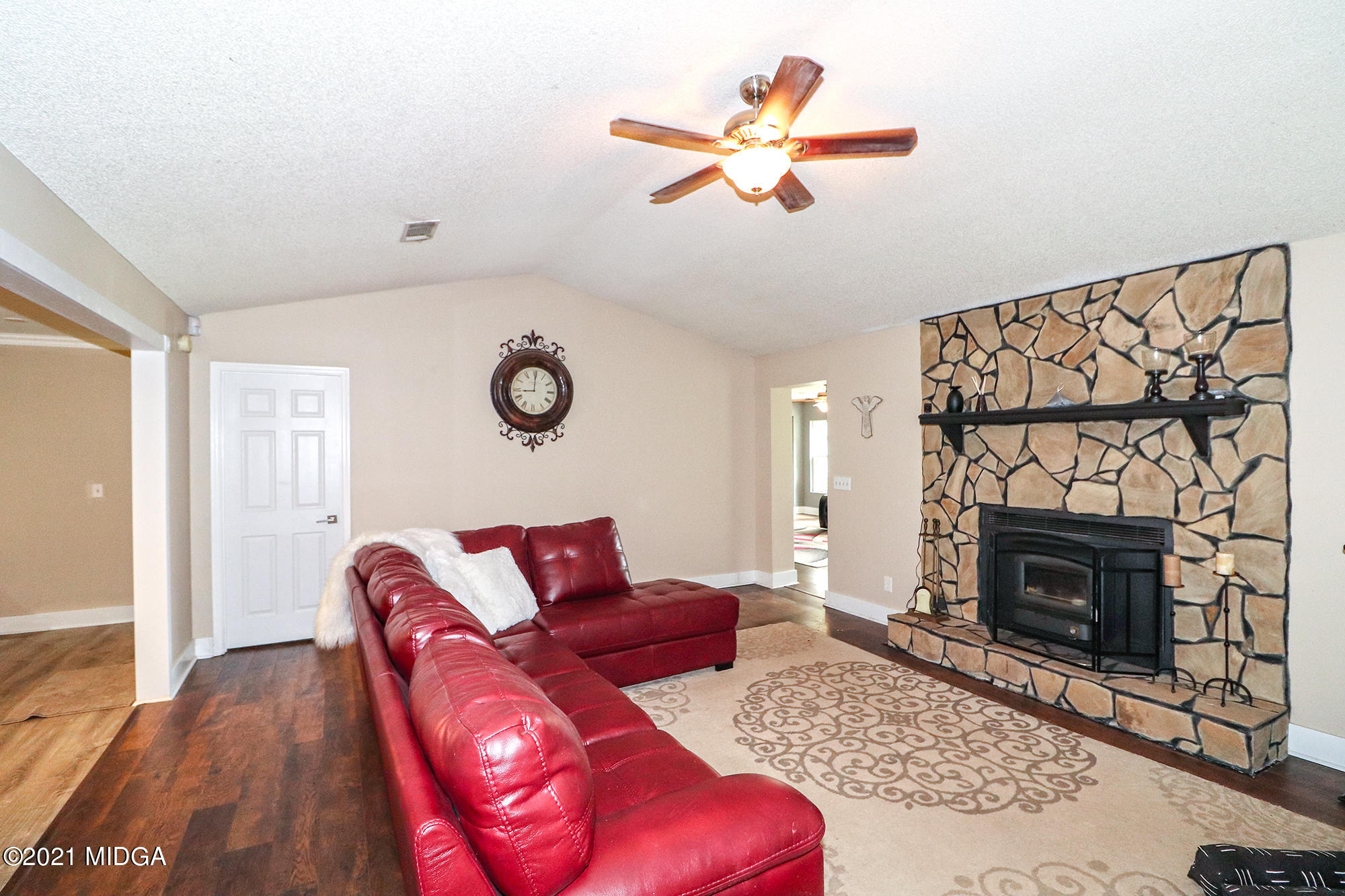 1571 Walker Road Byron, GA 31008 - Photo 18 of 60 a living room with furniture and a fireplace