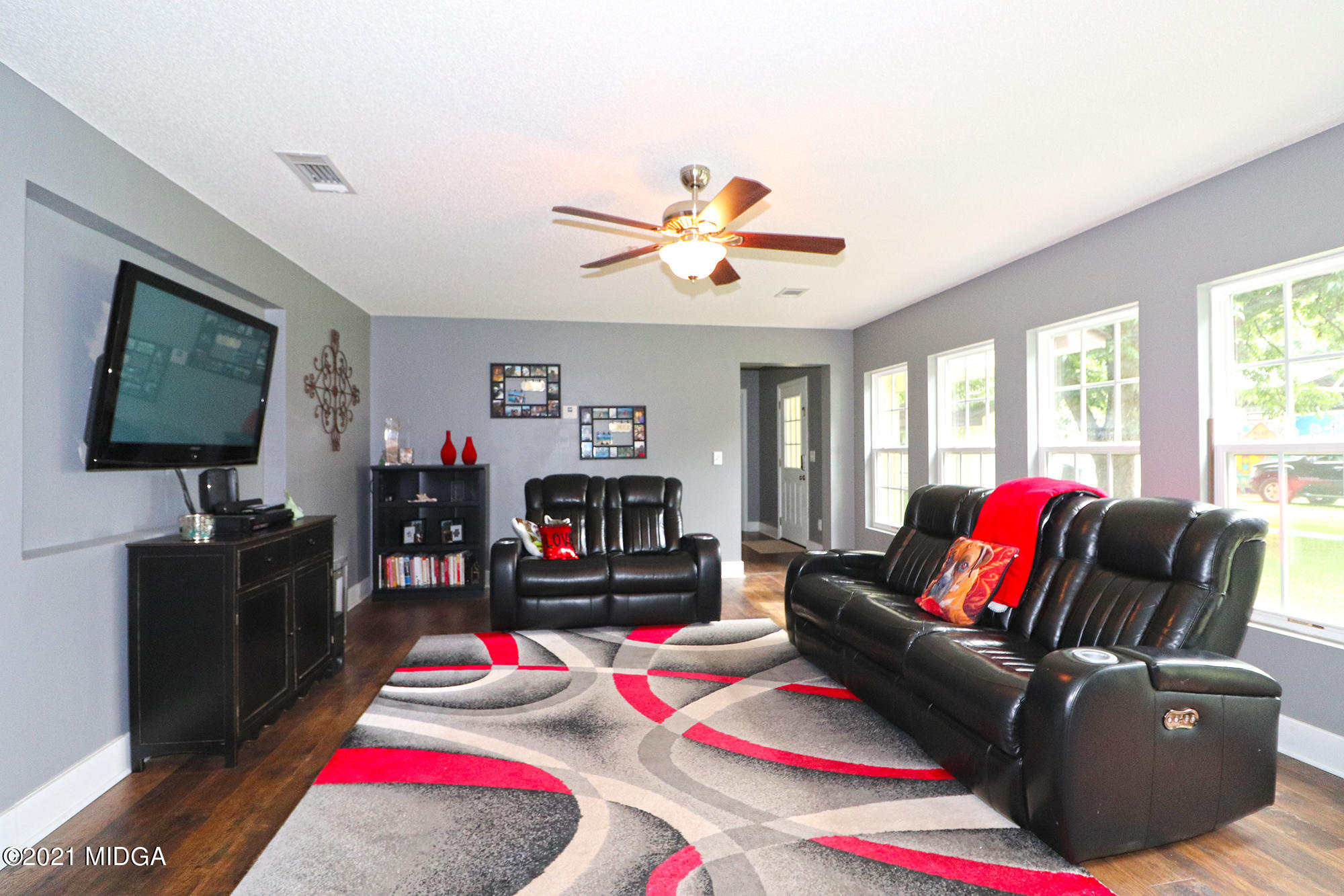 1571 Walker Road Byron, GA 31008 - Photo 22 of 60 a living room with furniture fireplace and flat screen tv