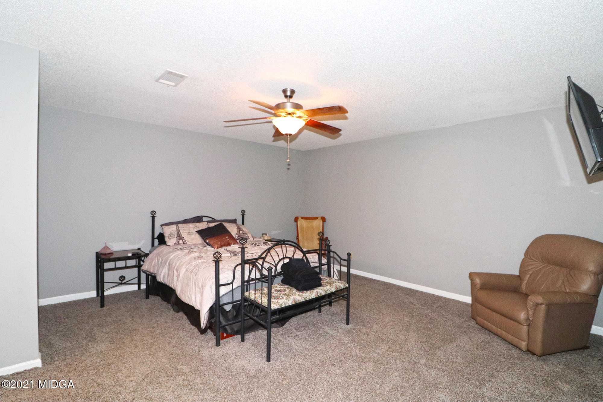 1571 Walker Road Byron, GA 31008 - Photo 31 of 60 a bed room with a bed window and a chair