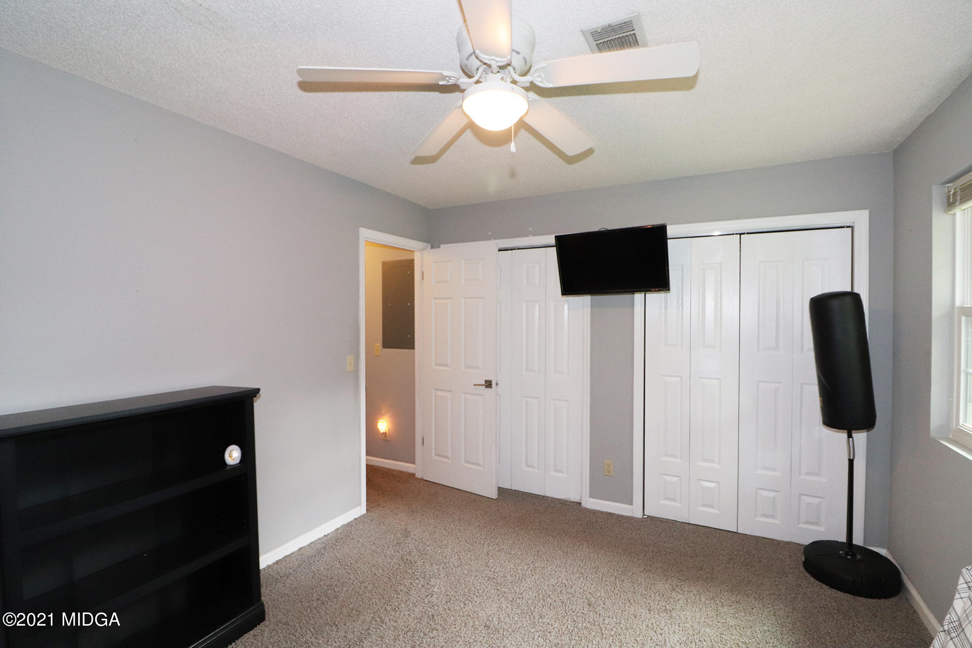 1571 Walker Road Byron, GA 31008 - Photo 35 of 60 a view of a livingroom with a chandelier fan and a window