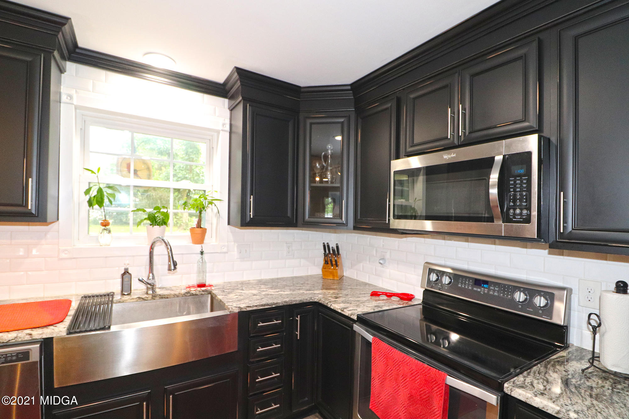 1571 Walker Road Byron, GA 31008 - Photo 8 of 60 a kitchen with a sink stove top oven and microwave
