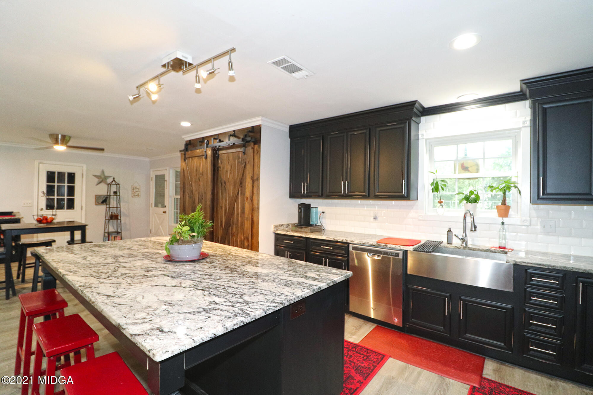 1571 Walker Road Byron, GA 31008 - Photo 10 of 60 a kitchen with a stove and a sink