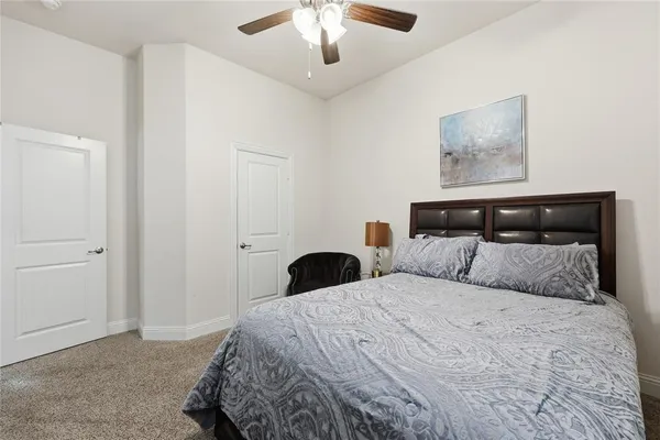 a living room with furniture a flat screen tv and a window