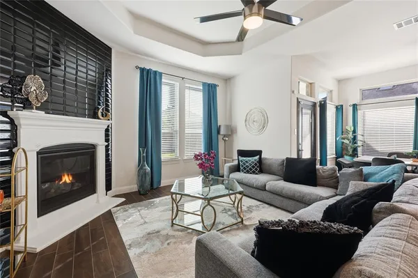 a living room with furniture and a fireplace