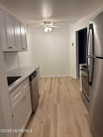 a kitchen with a sink and cabinets