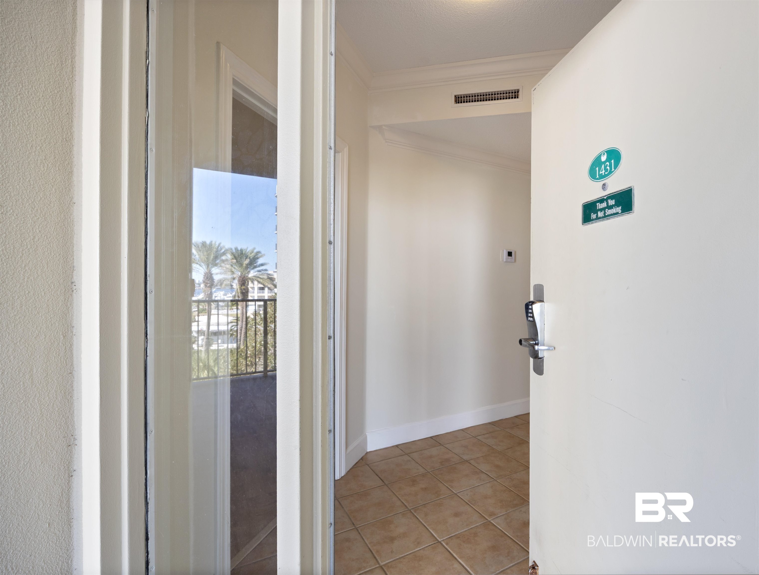 27580 Canal Road, Unit 1431 Orange Beach, AL 36561 - Photo 7 of 73 Hall with ornamental molding and light tile patterned floors