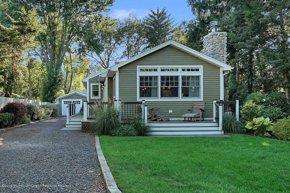 907 Brooks Road Point Pleasant, NJ 08742 - Photo 1 of 33 a front view of a house with a yard