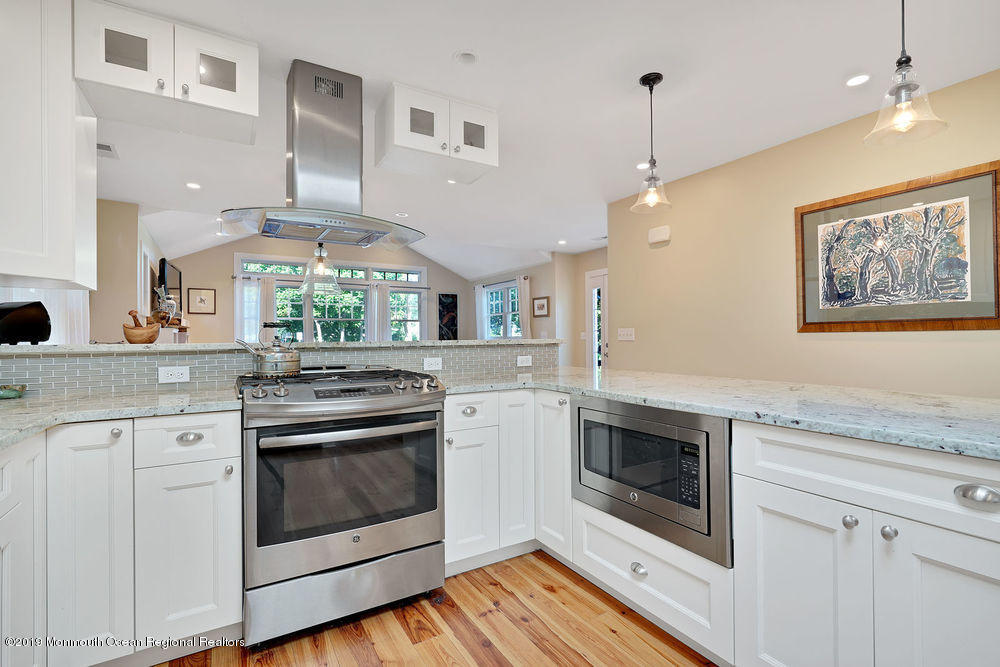 907 Brooks Road Point Pleasant, NJ 08742 - Photo 17 of 33 a kitchen with a stove and a sink