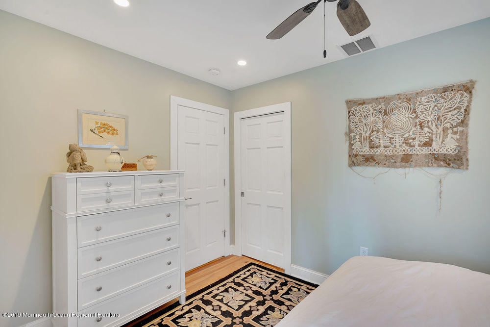 907 Brooks Road Point Pleasant, NJ 08742 - Photo 23 of 33 a bedroom with a bed and a dresser in it