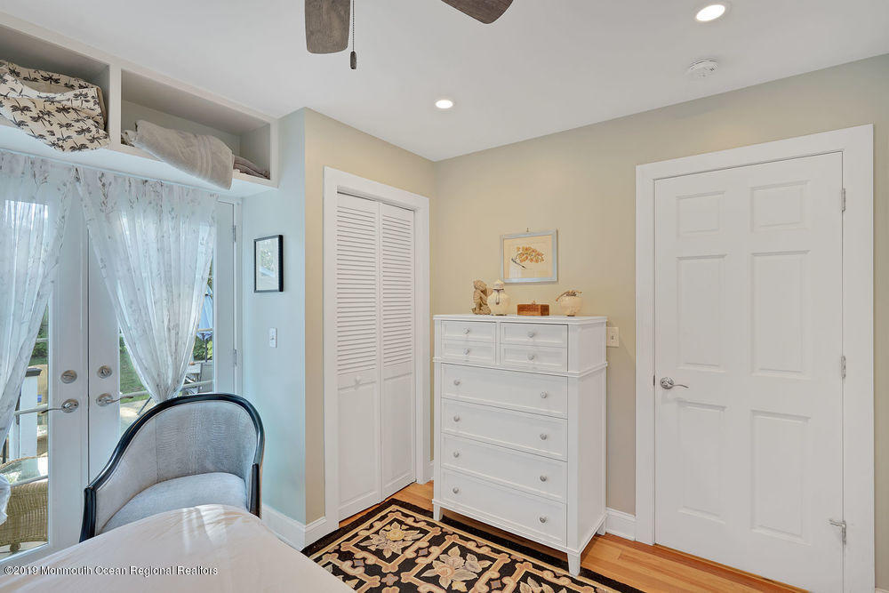 907 Brooks Road Point Pleasant, NJ 08742 - Photo 25 of 33 a bedroom with a bed and a dresser