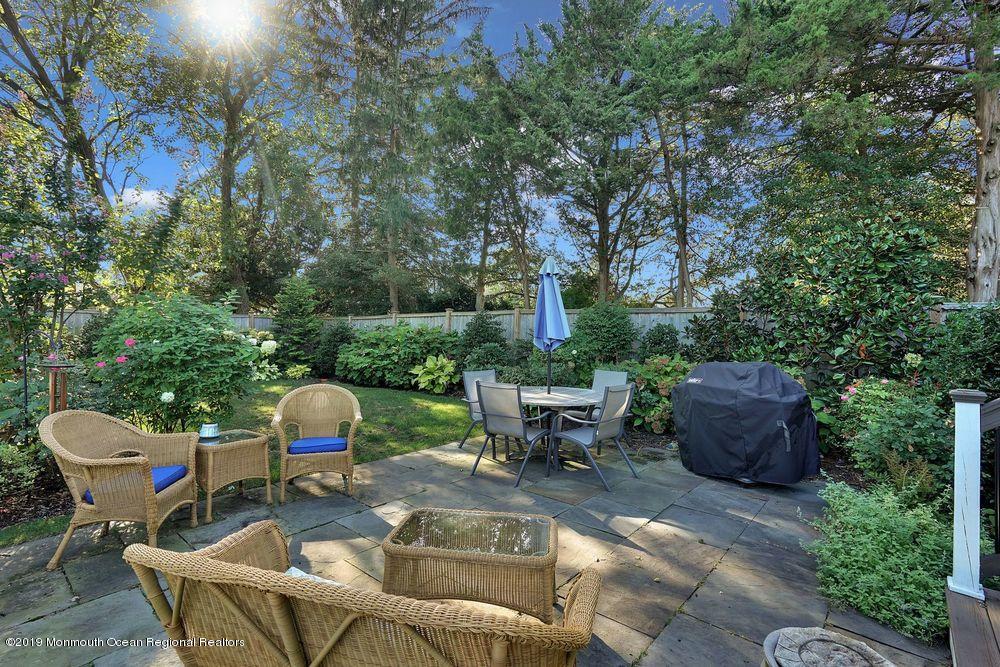 907 Brooks Road Point Pleasant, NJ 08742 - Photo 28 of 33 a view of backyard with seating space and trees