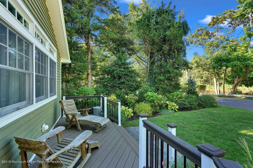 907 Brooks Road Point Pleasant, NJ 08742 - Photo 3 of 33 a view of balcony with furniture and garden