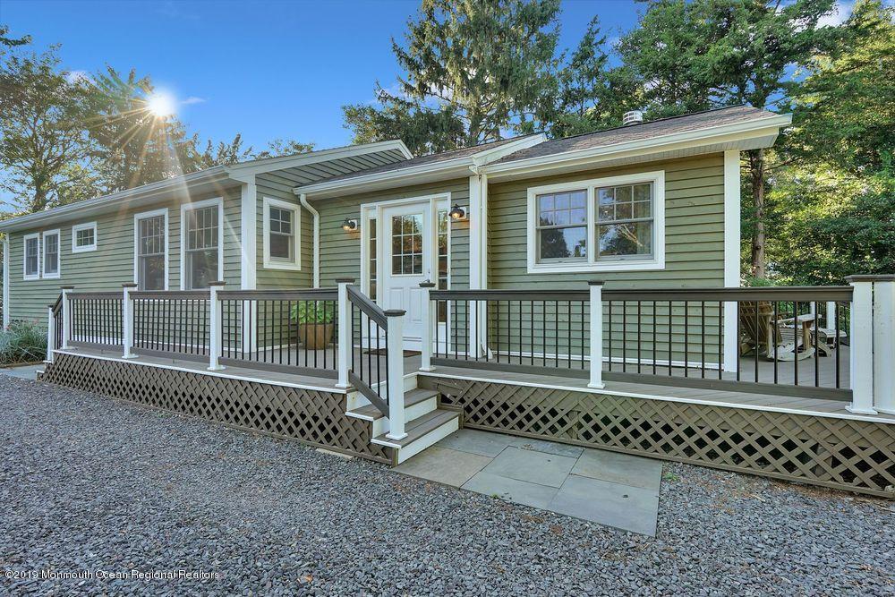 907 Brooks Road Point Pleasant, NJ 08742 - Photo 4 of 33 a front view of a house with a porch