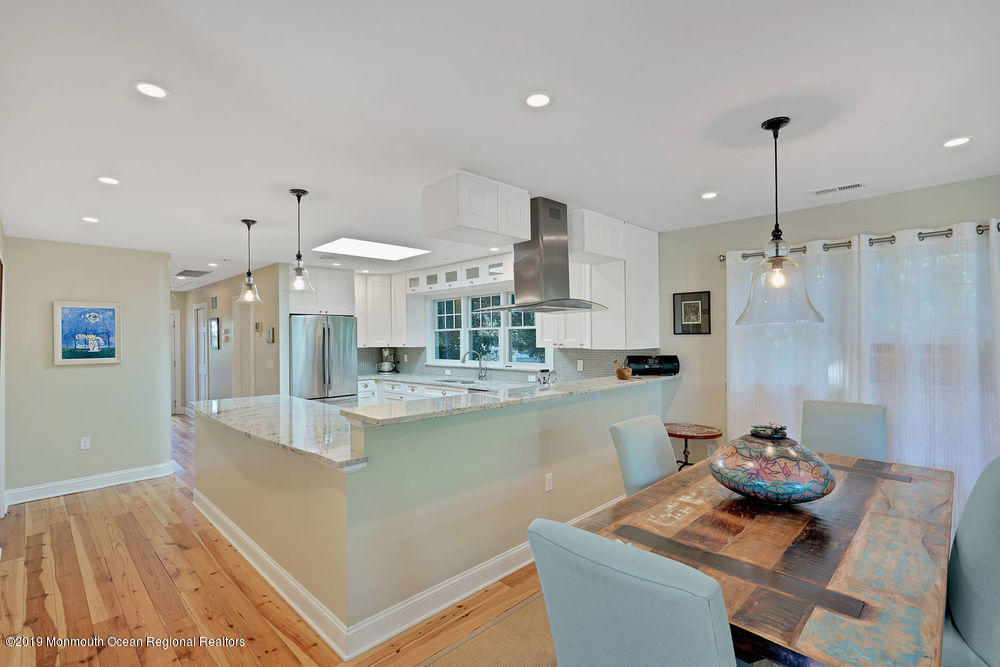 907 Brooks Road Point Pleasant, NJ 08742 - Photo 10 of 33 a kitchen with stainless steel appliances granite countertop a sink and a refrigerator