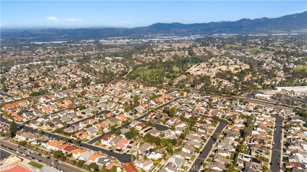 22351 Prairie Road Lake Forest, CA 92630 - Photo 2 of 2 an aerial view of residential houses with outdoor space and trees