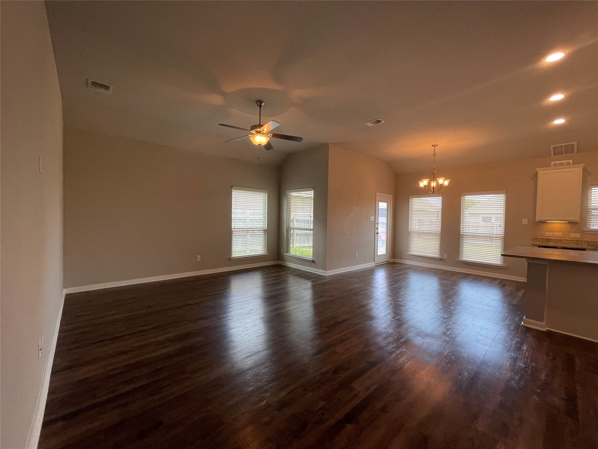 8113 Northgate Loop Temple, TX 76502 - Photo 6 of 35 Open-concept living space featuring wood-finish flooring, multiple windows, a ceiling fan, and recessed lighting