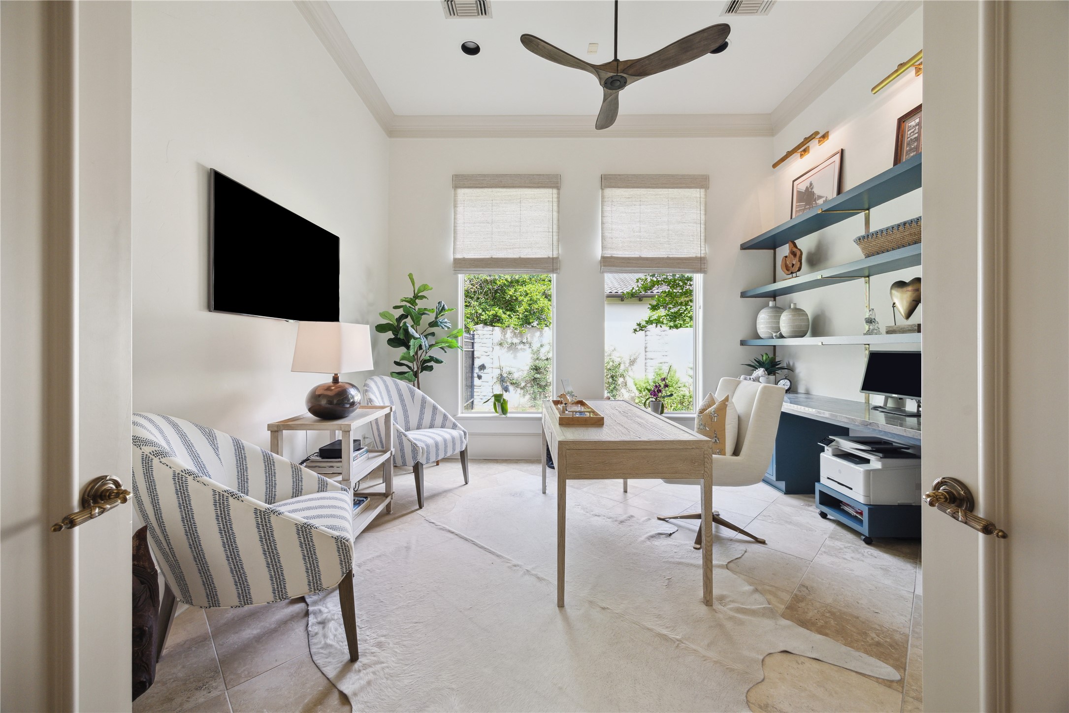 11607 Barazi Oaks Court Houston, TX 77024 - Photo 16 of 43 a living room with furniture a flat screen tv and a large window