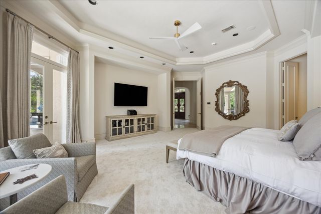 a large spacious bathroom with a tub a double vanity sink a mirror and a shower