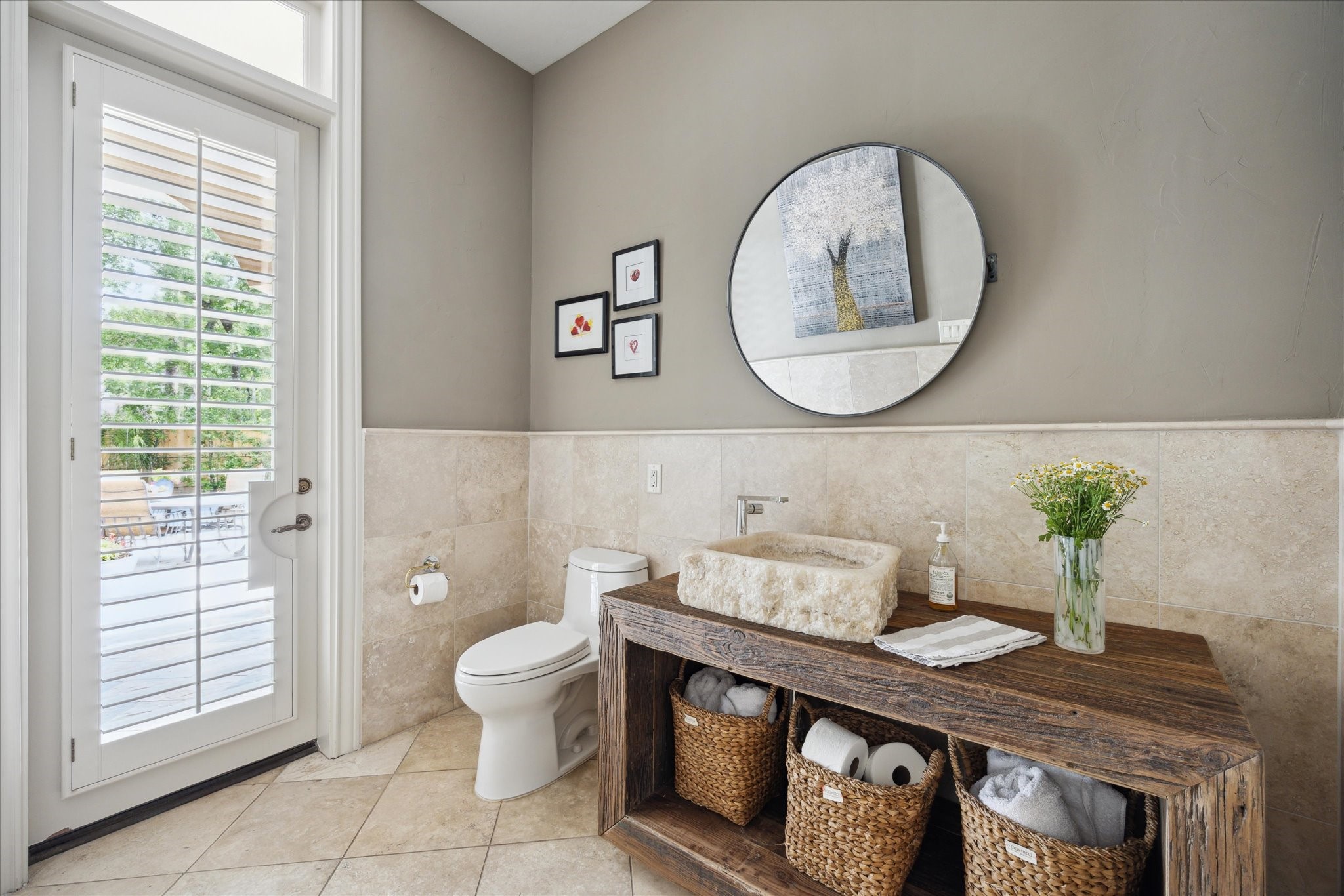 11607 Barazi Oaks Court Houston, TX 77024 - Photo 22 of 43 a bathroom with a granite countertop toilet sink and mirror