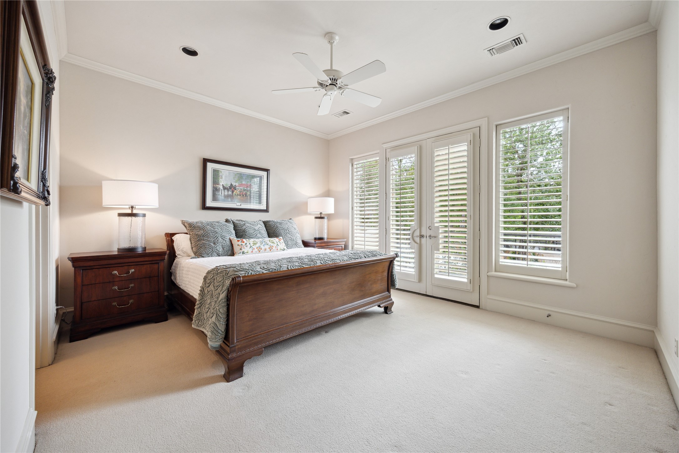 11607 Barazi Oaks Court Houston, TX 77024 - Photo 29 of 43 a spacious bedroom with a bed and a large window