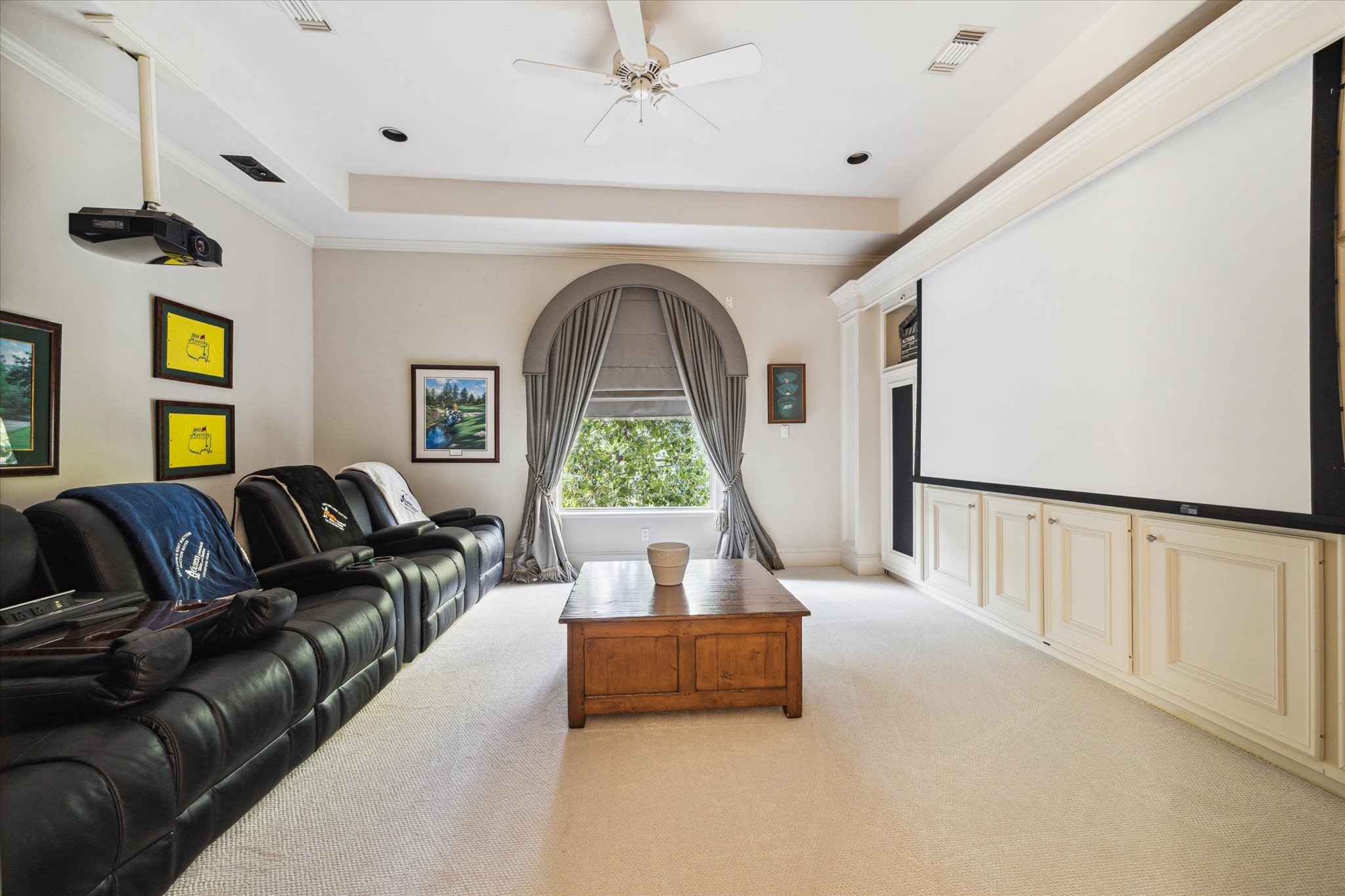 11607 Barazi Oaks Court Houston, TX 77024 - Photo 33 of 43 a living room with furniture and a large window