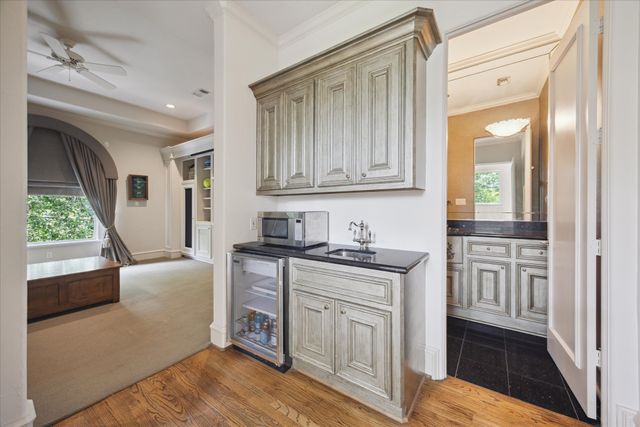 a view of a kitchen with washing machine and a sink