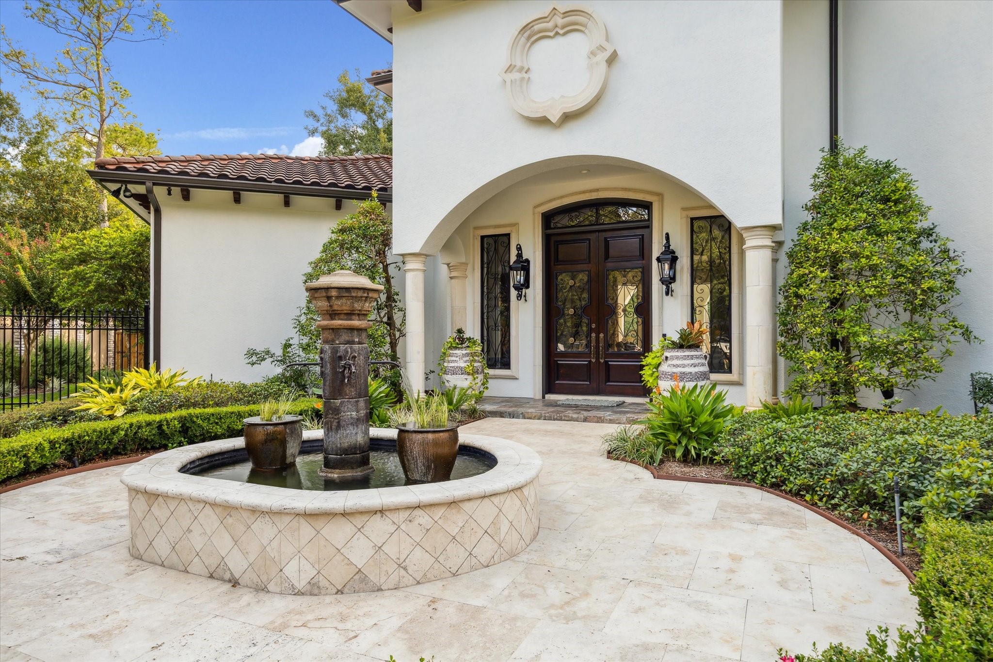 11607 Barazi Oaks Court Houston, TX 77024 - Photo 36 of 43 a front view of a house with garden