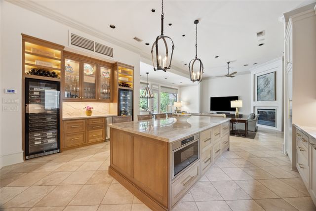 a kitchen with stainless steel appliances granite countertop a stove and cabinets