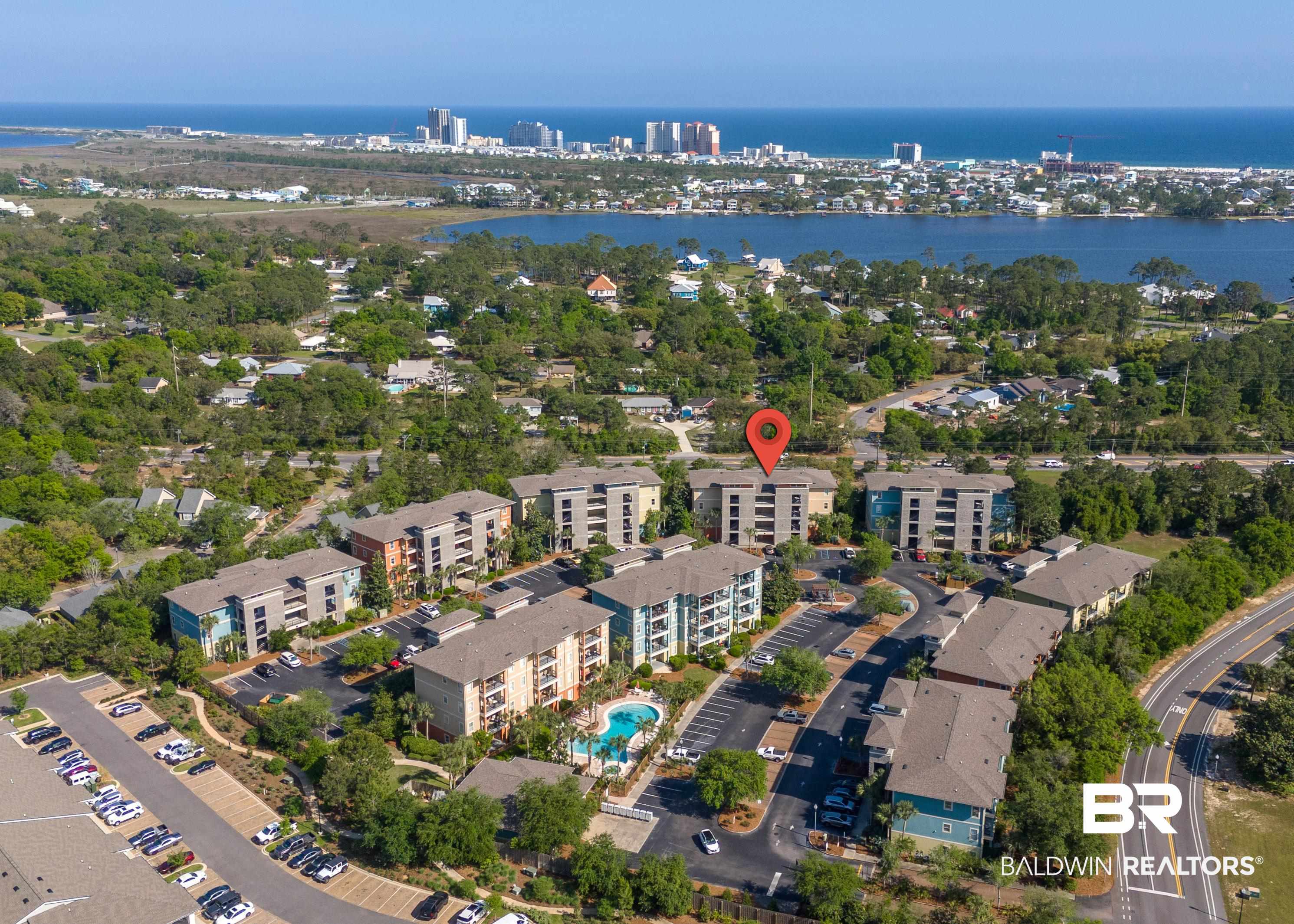 1430 Regency Road, Unit C201 Gulf Shores, AL 36542 - Photo 19 of 54 View of property location with a nearby body of water and a pool area