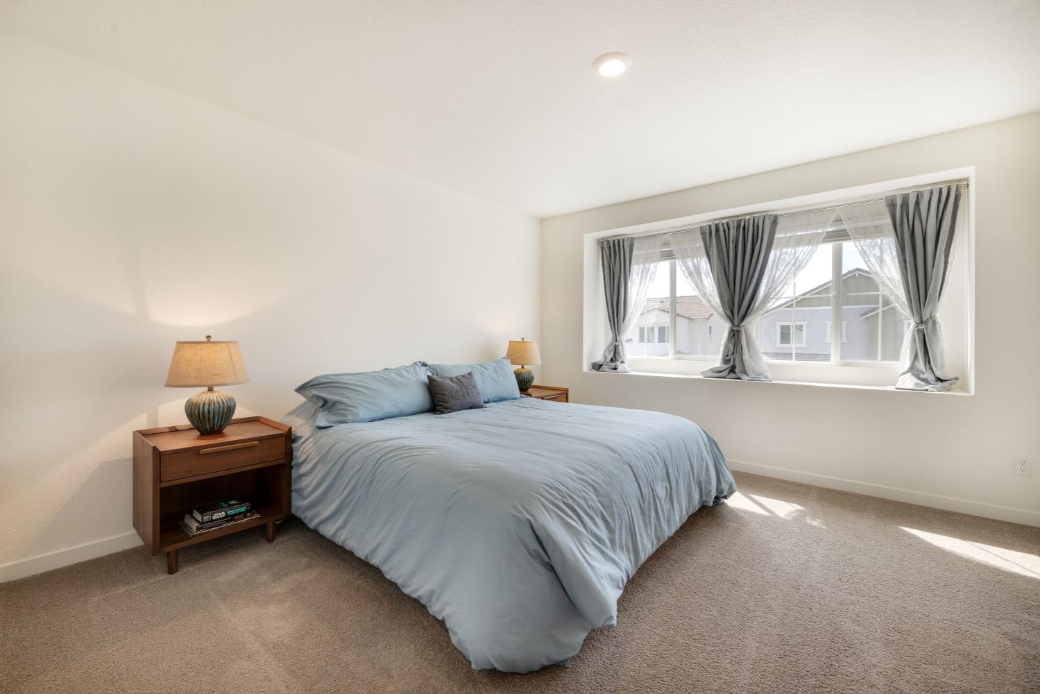 4041 Trailblazer Loop Roseville, CA 95747 - Photo 11 of 23 a bedroom with bed and a window