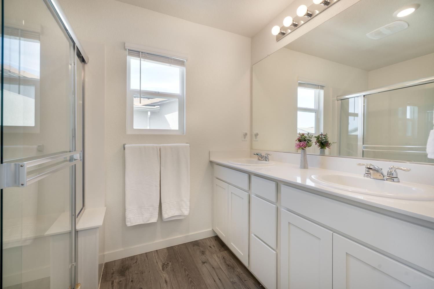 4041 Trailblazer Loop Roseville, CA 95747 - Photo 13 of 23 a bathroom with a double vanity sink and a mirror