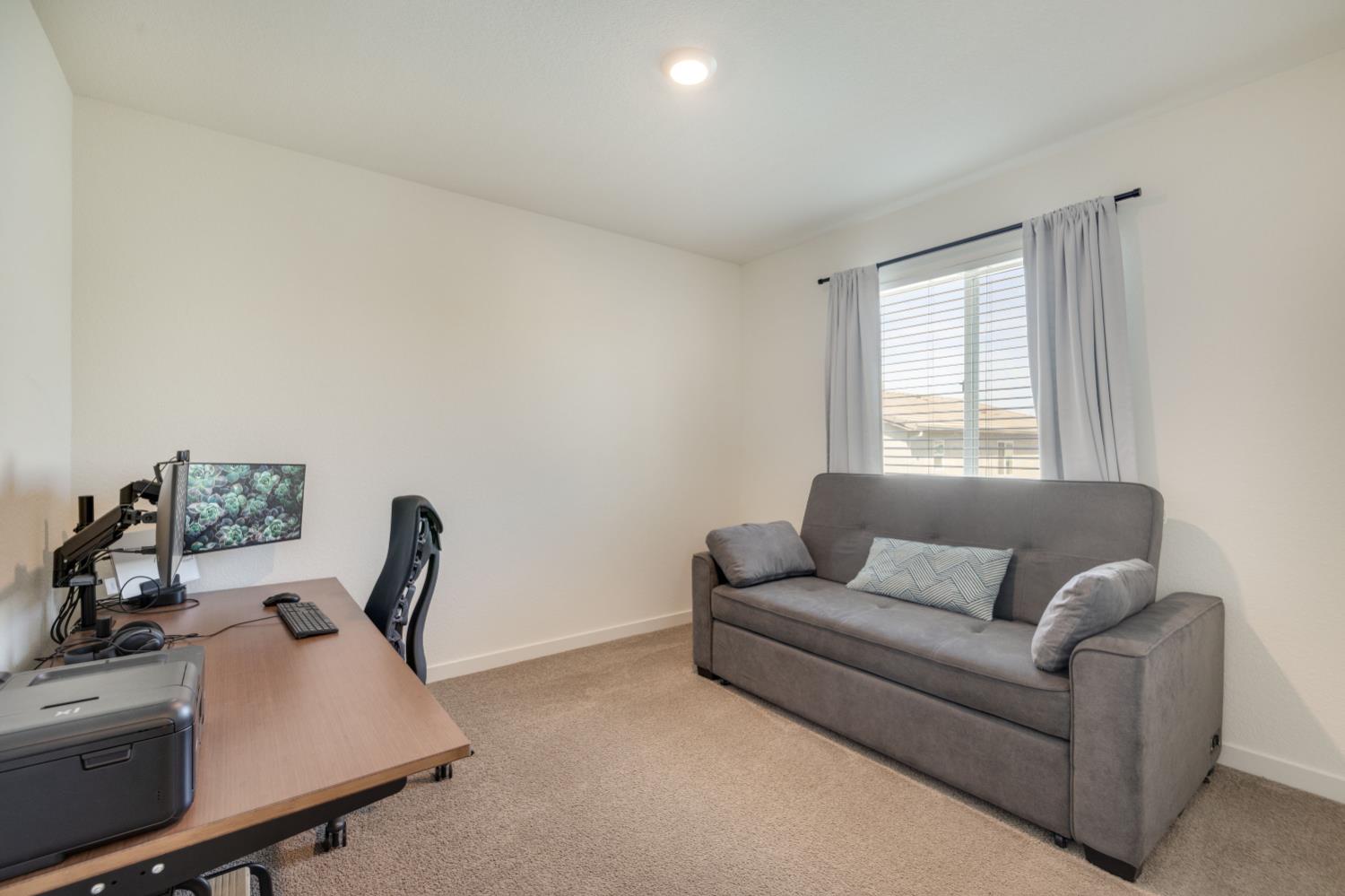 4041 Trailblazer Loop Roseville, CA 95747 - Photo 17 of 23 a living room with furniture and a window