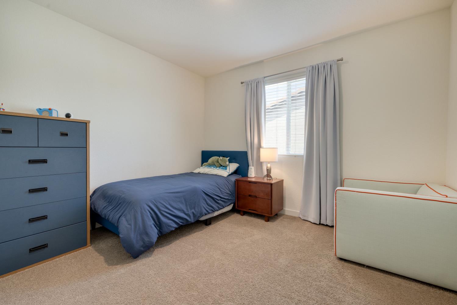 4041 Trailblazer Loop Roseville, CA 95747 - Photo 18 of 23 a bedroom with a bed and a window