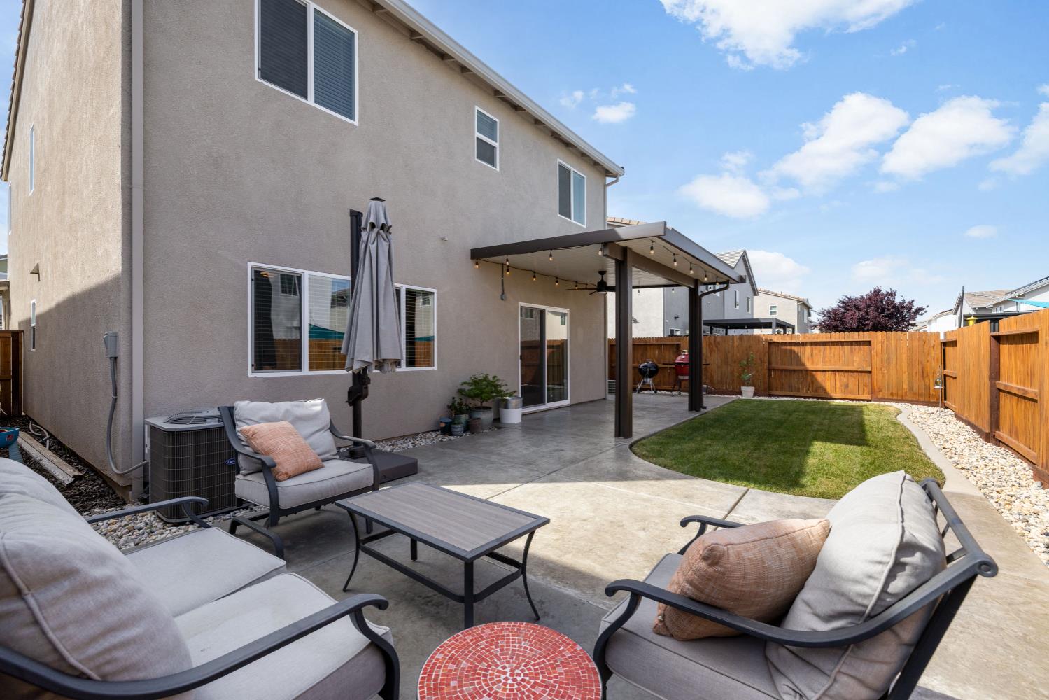 4041 Trailblazer Loop Roseville, CA 95747 - Photo 20 of 23 a backyard of a house with seating space