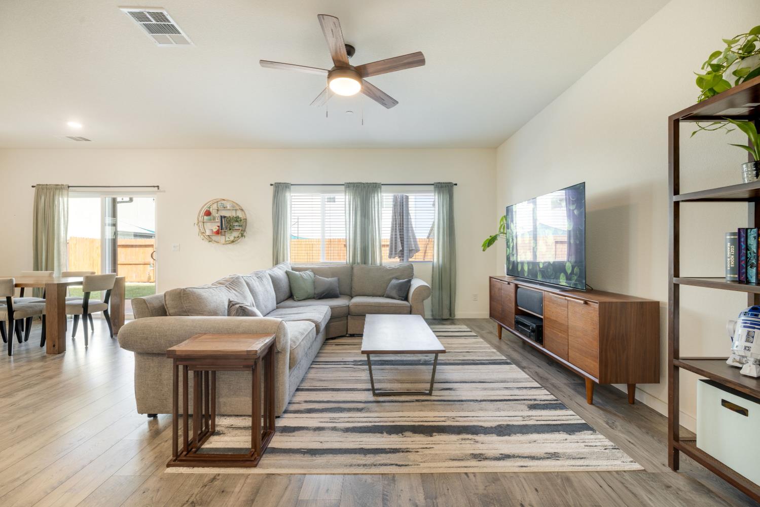 4041 Trailblazer Loop Roseville, CA 95747 - Photo 5 of 23 a living room with furniture and a flat screen tv