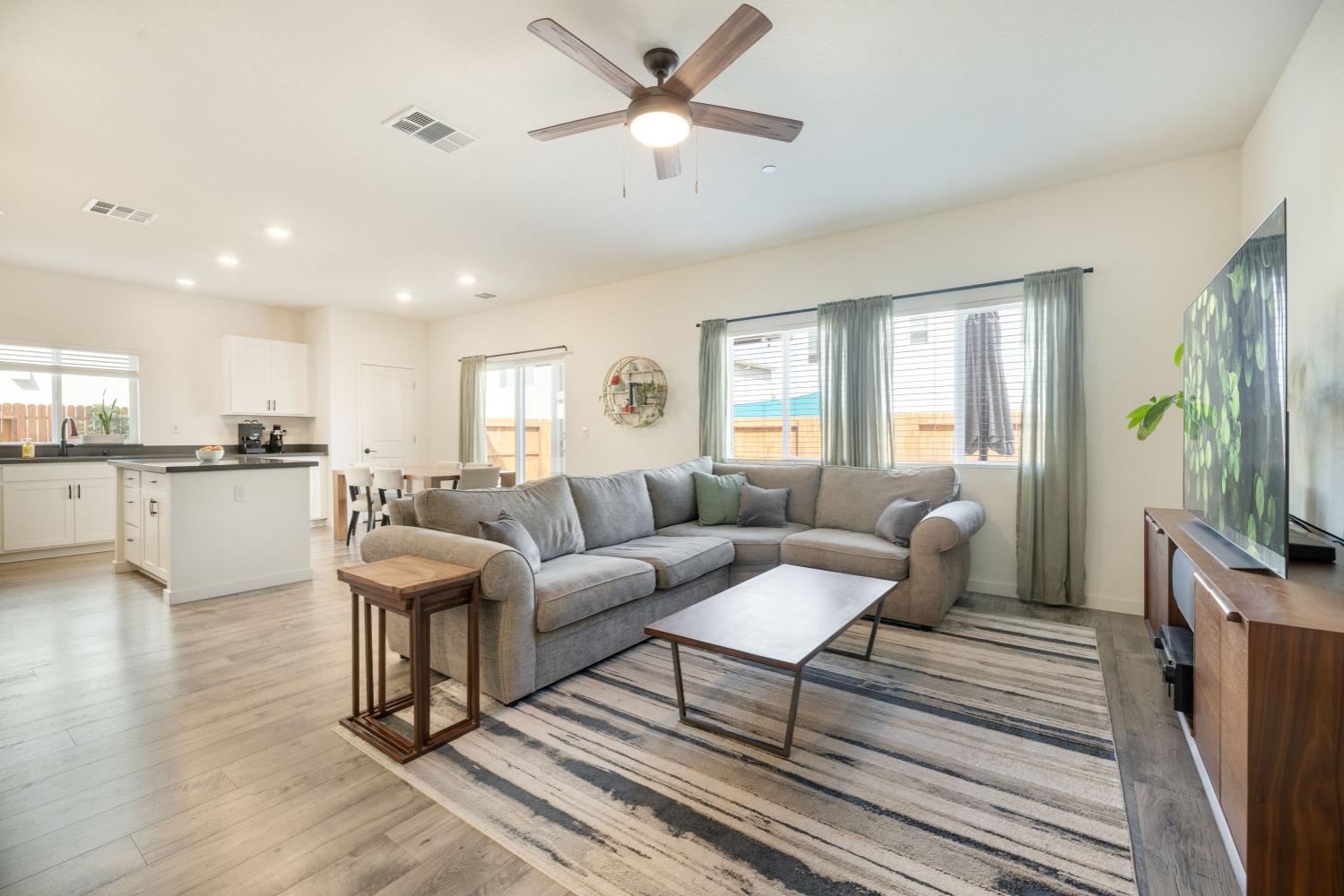 4041 Trailblazer Loop Roseville, CA 95747 - Photo 6 of 23 a living room with furniture and a flat screen tv