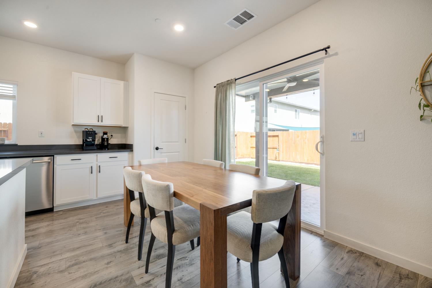 4041 Trailblazer Loop Roseville, CA 95747 - Photo 9 of 23 a view of a dining room with furniture and wooden floor