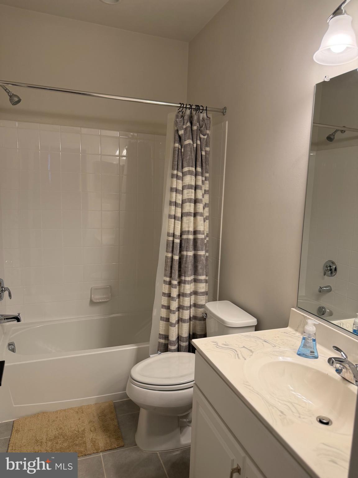 23463 Simms Gap Way Ashburn, VA 20148 - Photo 7 of 10 a bathroom with a sink toilet and shower