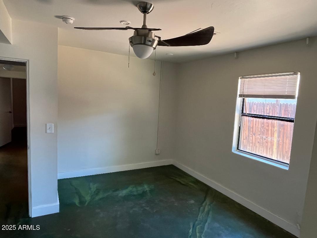 1006 East Weldon Avenue Phoenix, AZ 85014 - Photo 24 of 34 a view of a small space with wooden floor and a window