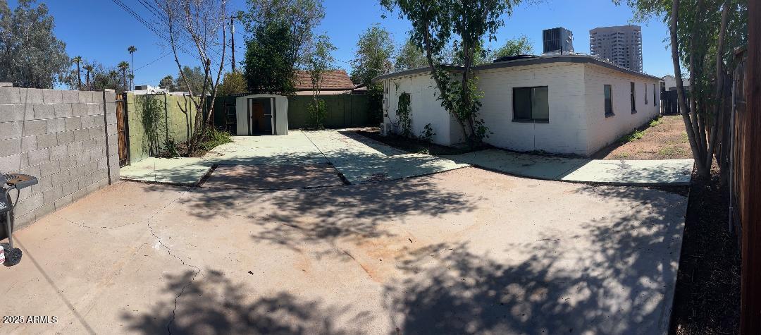 1006 East Weldon Avenue Phoenix, AZ 85014 - Photo 30 of 34 a view of a white house with a yard