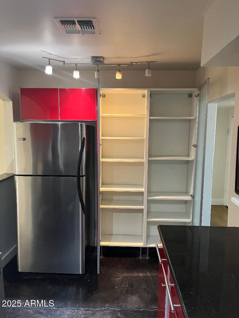 1006 East Weldon Avenue Phoenix, AZ 85014 - Photo 5 of 34 a refrigerator freezer sitting in a kitchen