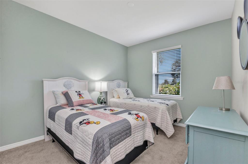7028 North Plum Tree Punta Gorda, FL 33955 - Photo 26 of 57 a bedroom with a bed and a table