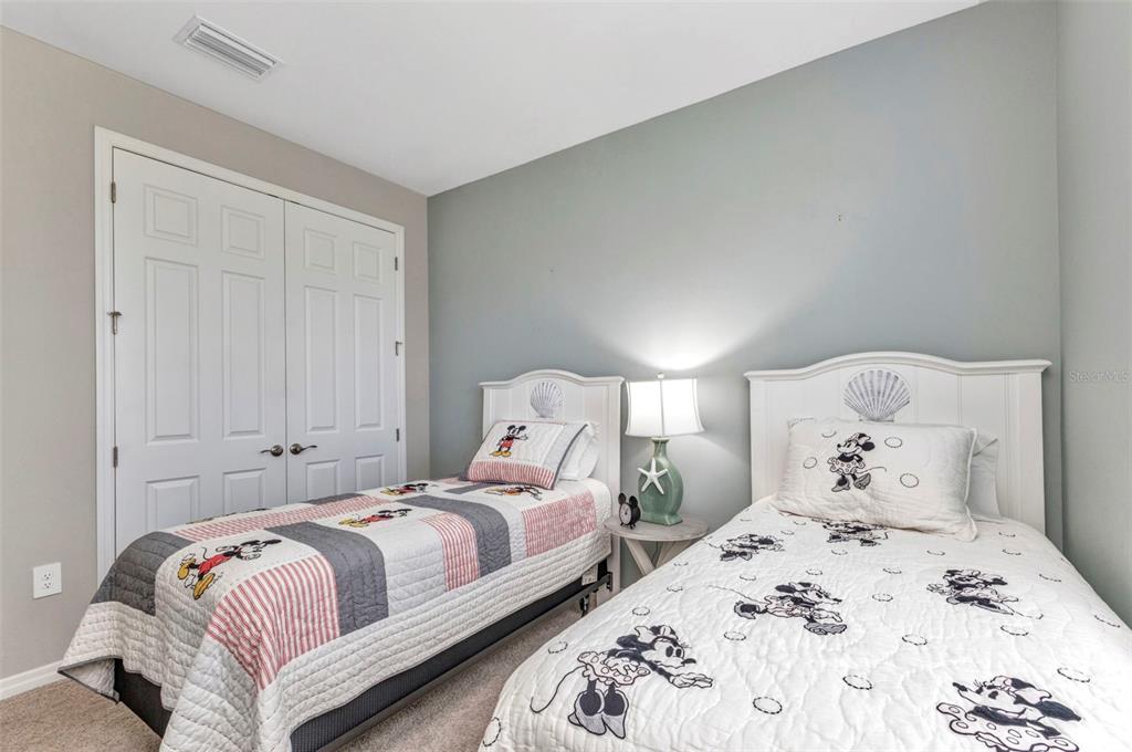 7028 North Plum Tree Punta Gorda, FL 33955 - Photo 27 of 57 a bedroom with two bed and a window