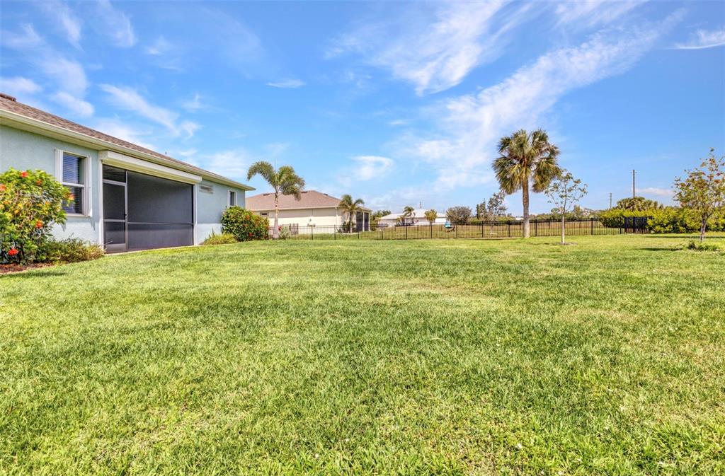 7028 North Plum Tree Punta Gorda, FL 33955 - Photo 39 of 57 a backyard of a house with table and chairs