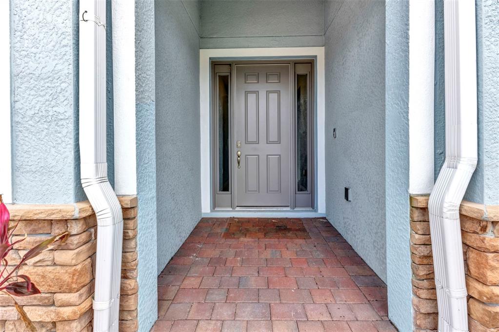 7028 North Plum Tree Punta Gorda, FL 33955 - Photo 5 of 57 a view of a hallway with wooden walls and floor to ceiling window